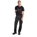 Craftsman wearing Blaklader 15991860 Black Craftsman Work Trousers, demonstrating fit and functionality during use.