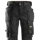 Black 6241 pants with multiple pockets and branded logo on a white background