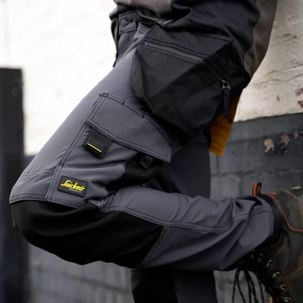 Snickers Workwear trousers and work pants displayed on site, including stretch and craftsman styles, available from Kustom Workwear.