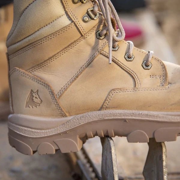 Close-up angled view of a tan work boot showing laces and tread detail, part of the best selling work boots collection at Kustom Workwear.