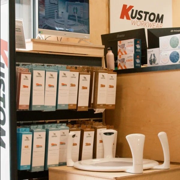 In‑store image showing the Aetrex foot scanner display at Kustom Workwear.