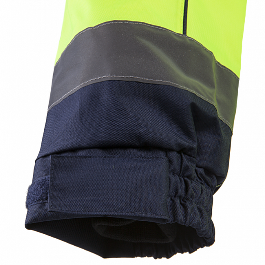 Close-up of a reflective safety jacket with yellow, gray, and navy colours.