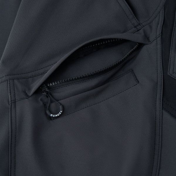 Close-up of a black coat with a zipper, featuring the brand logo.