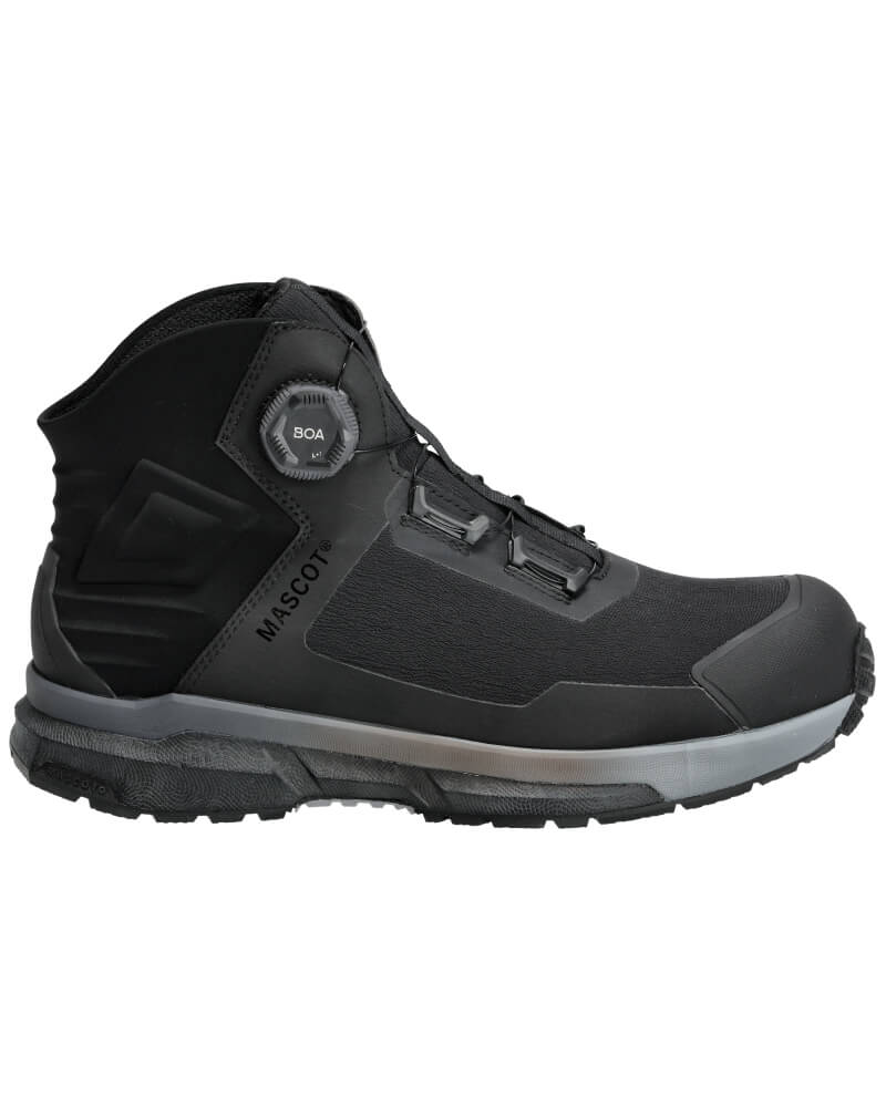 A navy blue safety boot with a composite toe cap, featuring a BOA fit system dial, memory foam lining, and a rubber outer sole with a 3D-printed pattern. The boot has a carbon plate in the midsole for energy return and is marked as ESD approved.