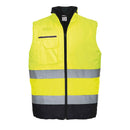 Yellow safety Portwest vest with reflective strip on a white background. High Visibility bodywarmer.