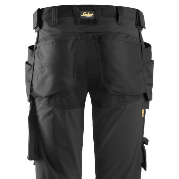 Black work pants with multiple pockets and a visible brand logo on a white background.