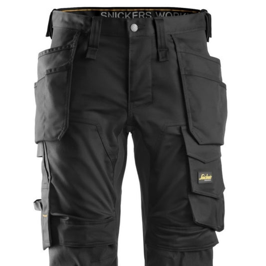 Black 6241 pants with multiple pockets and branded logo on a white background