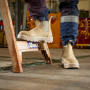 Worker stepping on ladder wearing Steel Blue Hobart boots in an industrial setting – Kustom Workwear.