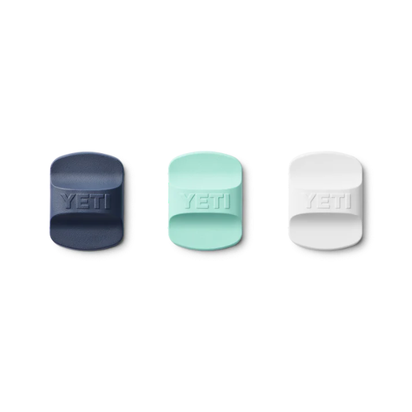 Three YETI bottle sliders in navy, green, and white on a white background. Yeti Drinkware available at Kustom Workwear Waterford.