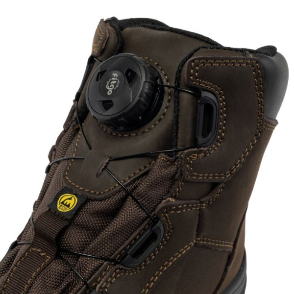 Side view of the Apache Churchill brown safety boot showing the padded ankle collar, elasticated side panels for easy entry and supportive pull‑on work boot construction, on a white background.
