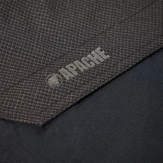 Close-up of a textured fabric surface with 'Apache' branding. Available at Kustom Workwear.