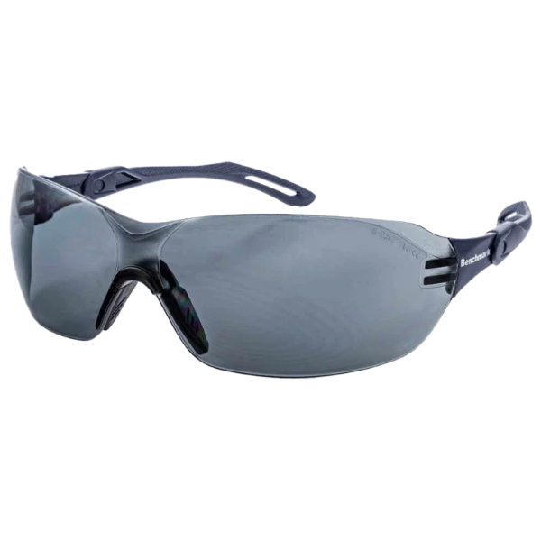 Side view of the Benchmark BME0012 safety glasses with a black frame and dark lenses, featuring a lightweight wraparound design, integrated nose bridge and slim ergonomic arms for a secure and comfortable fit, photographed on a transparent background.