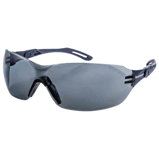 Side view of the Benchmark BME0012 safety glasses with a black frame and dark lenses, featuring a lightweight wraparound design, integrated nose bridge and slim ergonomic arms for a secure and comfortable fit, photographed on a transparent background.