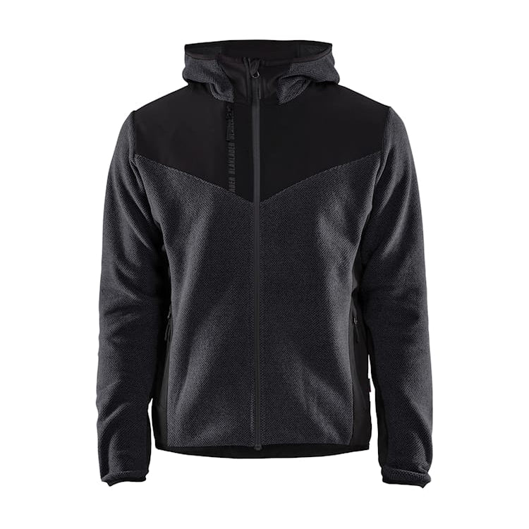 Front view of the Blaklader 5940 softshell knitted jacket in dark grey and black, featuring a full zip, stretch softshell panels and a high collar, on a white background.