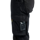 Close up view of D pocket on left leg of black work pants against a white background.