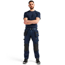 Model wearing Blaklader Craftsman Trousers Stretch 1750 in navy, demonstrating ergonomic fit and practical workwear design.