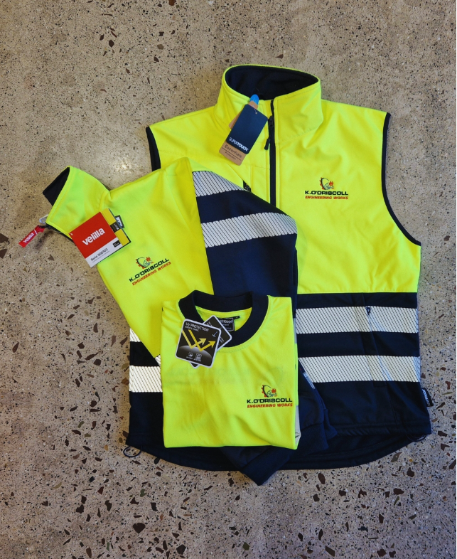 Hi-vis yellow and navy branded bodywarmer and polo shirt with embroidered company logo showing professional workwear uniform set.