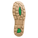 Close-up of a beige Steel Blue boot sole with green accents on a white background