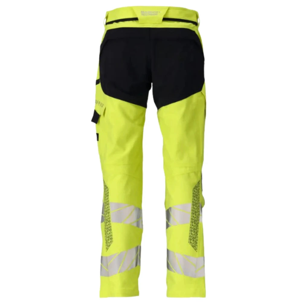 Back view of the Mascot Accelerate Hi-Vis Flame Retardant Work Trousers 21079-284 in hi-vis yellow and dark navy showing back pockets, reflective tape and ergonomic leg construction.
