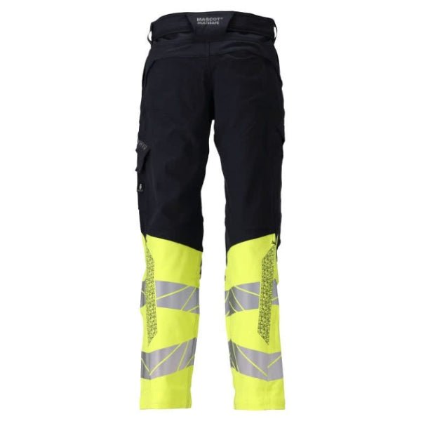 Back view of the Mascot Accelerate Flame Retardant Work Trousers 21179-284 in dark navy and hi-vis yellow showing back pockets, reflective tapes and ergonomic leg construction.