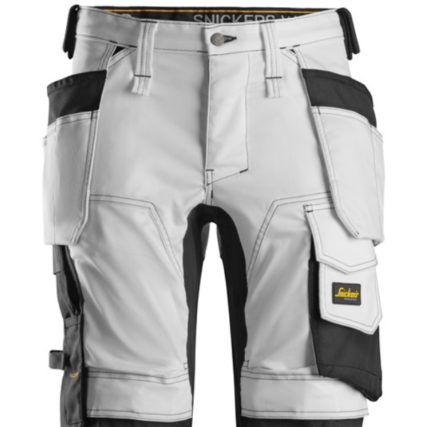 Gray and black work pants with multiple pockets on a white background