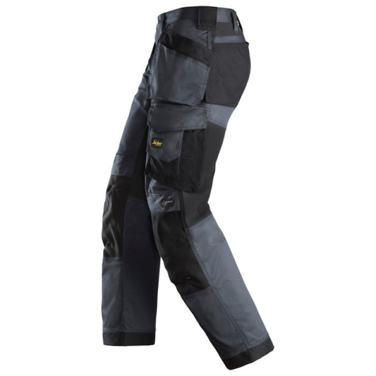 Snickers 6251 AllroundWork stretch trousers in steel grey and black, provided by Kustom Workwear in Waterford. These Snickers work trousers include multiple pockets, a loose ergonomic fit, and durable construction designed for skilled trades and everyday site work.