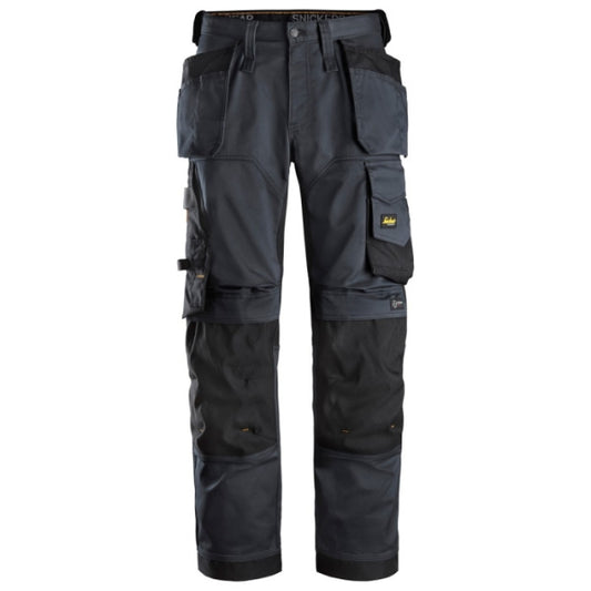 Snickers 6251 AllroundWork stretch loose fit work trousers with holster pockets in steel grey and black, available from Kustom Workwear in Waterford. These Snickers work trousers are built for comfort and utility with reinforced knee zones, 4-way stretch fabric, and a relaxed fit for demanding jobs.