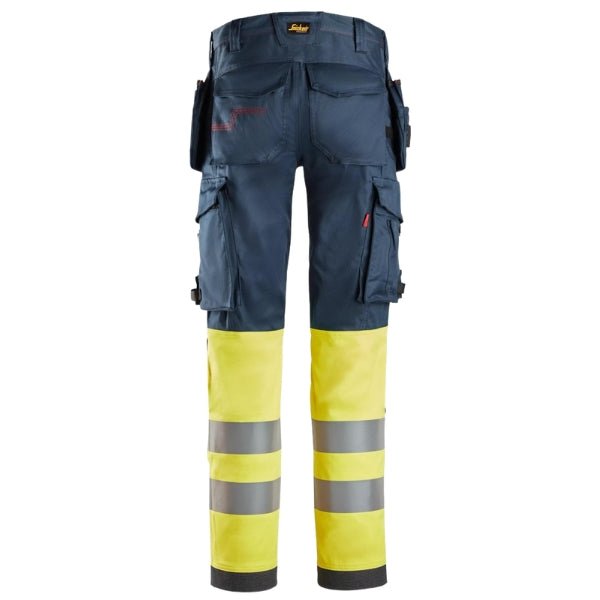Back view of the Snickers 6274 ProtecWork Arc Stretch Work Trousers in navy and high vis yellow showing bellowed back pockets and pre-bent leg construction.