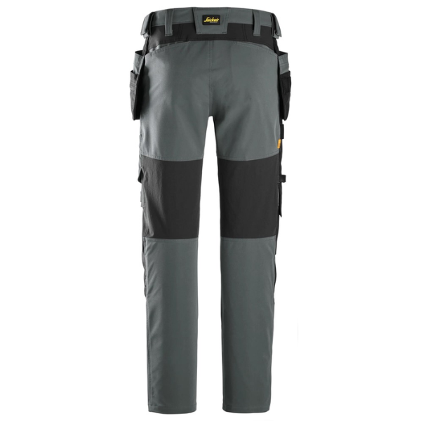 Back view of the Snickers AllroundWork Stretch Work Trousers 6218 in black and grey showing CORDURA knee reinforcements, stretch panels and integrated back pockets.