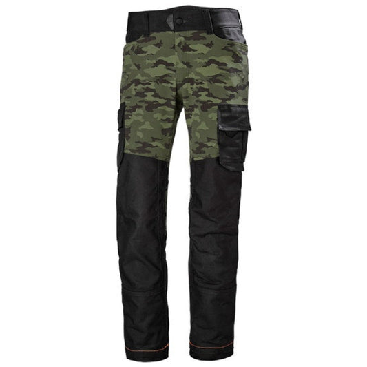A pair of Helly Hansen Chelsea Evolution Service Pants with camouflage pattern on the leg area and black on the upper area, featuring multiple pockets and a reinforced waistband.